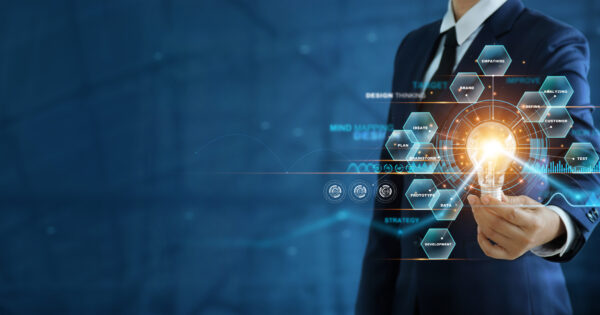 Businessman hand holding creative light bulb with marketing network icons on planning strategy, analysis solution and development, Modern business, Innovative of new ideas.